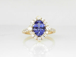 Yellow Gold Oval Tanzanite Ring with Diamond Halo and Shanks