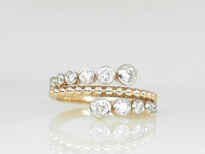 Yellow Gold Graduated Bezel Set Diamond Band