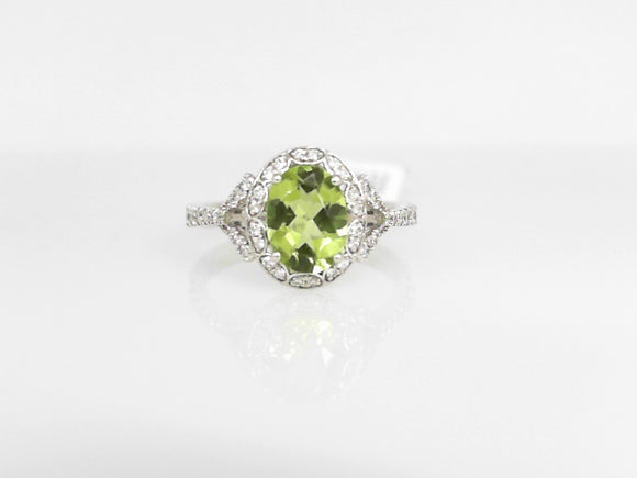 White Gold Oval Peridot Ring with a Diamond Halo