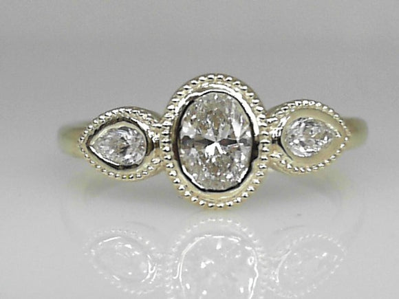 Yellow Gold Oval and Pear Diamond Bezel Set Ring