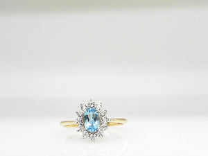 10k Yellow Gold Swiss Blue Topaz (0.50ct)  and Diamond (0.03ctw)  Halo Ring