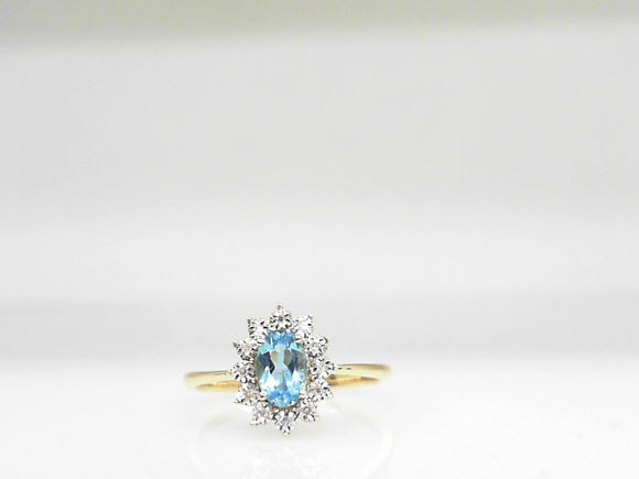 10k Yellow Gold Swiss Blue Topaz (0.50ct)  and Diamond (0.03ctw)  Halo Ring