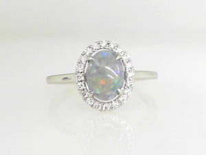 White Gold Oval Opal Ring with 0.14 CT Diamond Halo