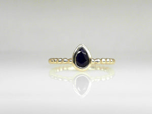 Yellow Gold Bezel Set Pear Shaped Sapphire Ring with Beaded Shanks