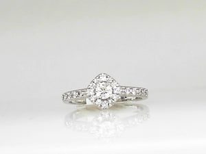 White Gold Round Diamond Engagement Ring with a Diamond Halo and Shanks
