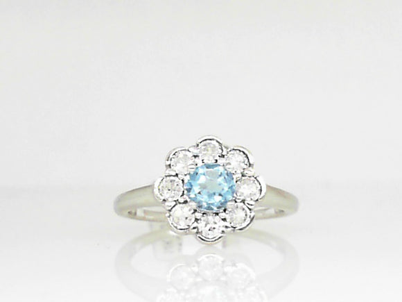 White Gold Blue Topaz Ring with Flower Shaped Diamond Halo