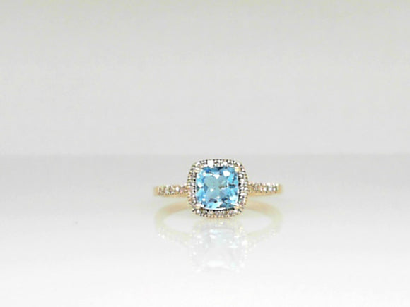 Yellow Gold Cushion Cut Blue Topaz Ring with a .13 CT Diamond Halo