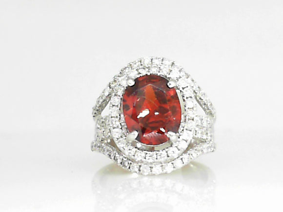 White Gold Oval Garnet Ring with Diamond Halo and Shank
