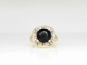 Yellow Gold Onyx Ring with .22 CT Diamonds and Twisted YG Halo
