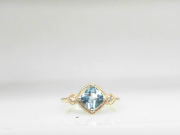 10k Yellow Gold Blue Topaz (0.96ct) and Diamond (0.01ctw) Ring